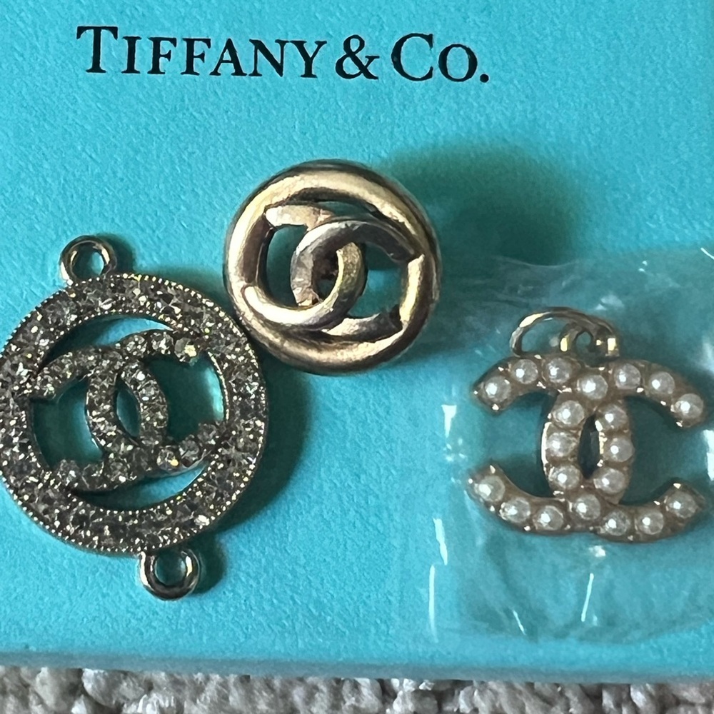 CHANEL Gold and Silver pendants and pins with Iconic CC Design
